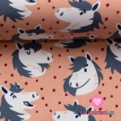 Úplet potisk šťastní koníci mezi nepravidelnými puntíky na růžové