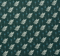 Úplet béžové listy na tmavě zelené