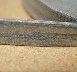 Šikmý proužek / lemovací pruženka šedá střední 19mm