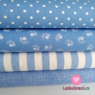 Bavlněné plátno bílé kytičky s lístečky z puntíků na modré 