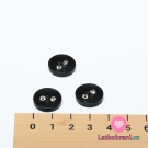 Knoflík kulatý, lesklý, černý s dvěma kamínky